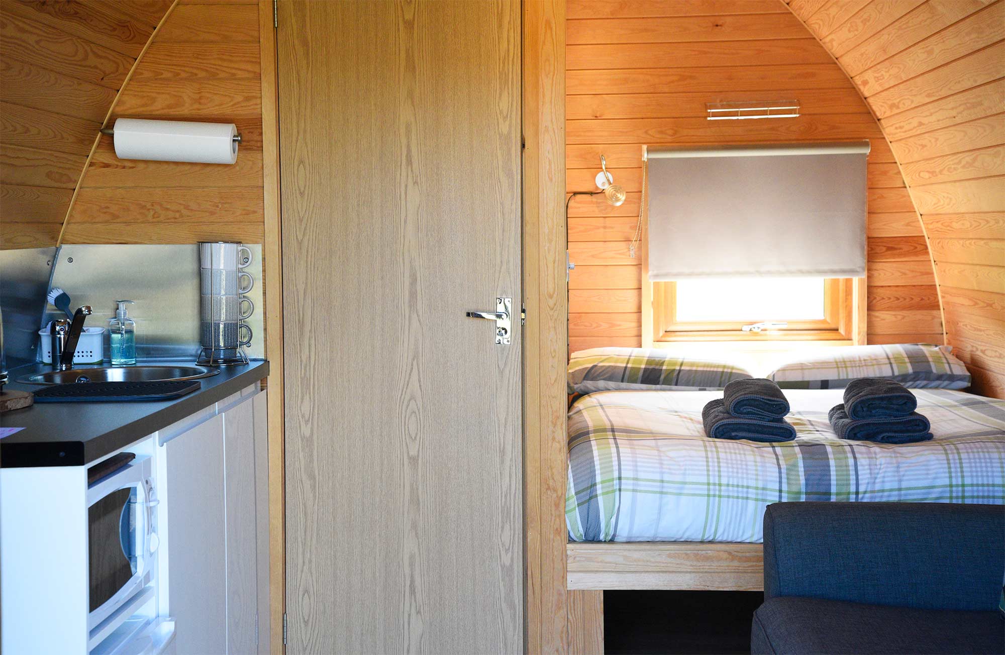 Experience the Isle of Skye at Skeabost View Pods including kitching and living room
